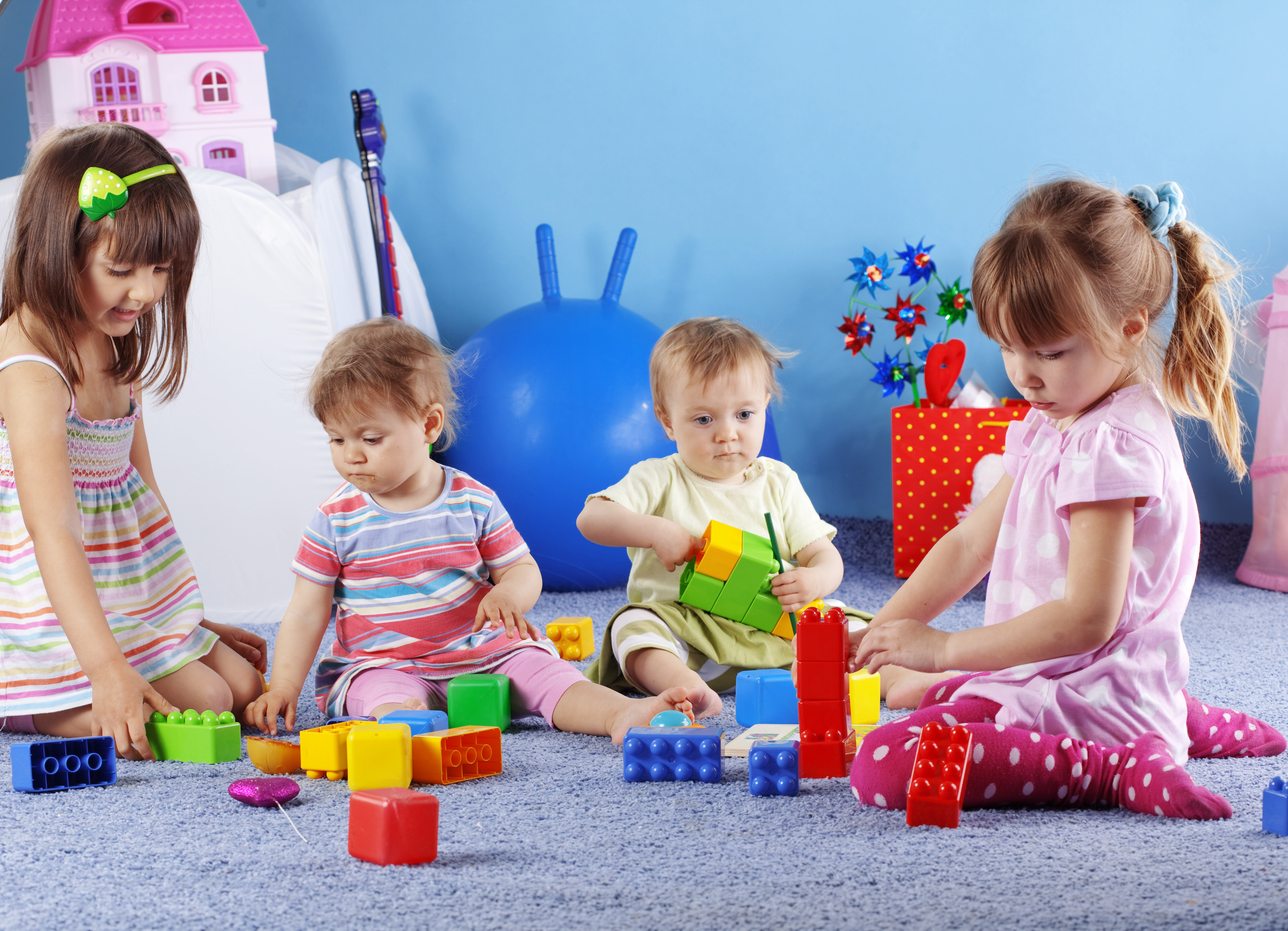 Group of kids playing with constructor